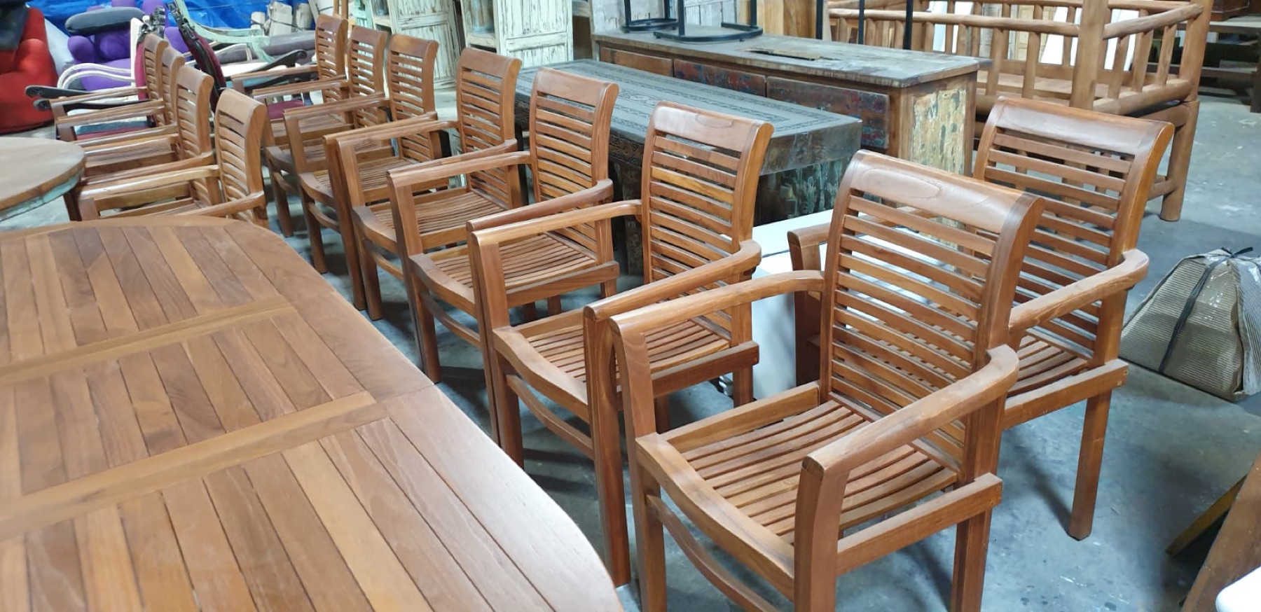 Kaliuda teak dining armchairs in the workshop showroom