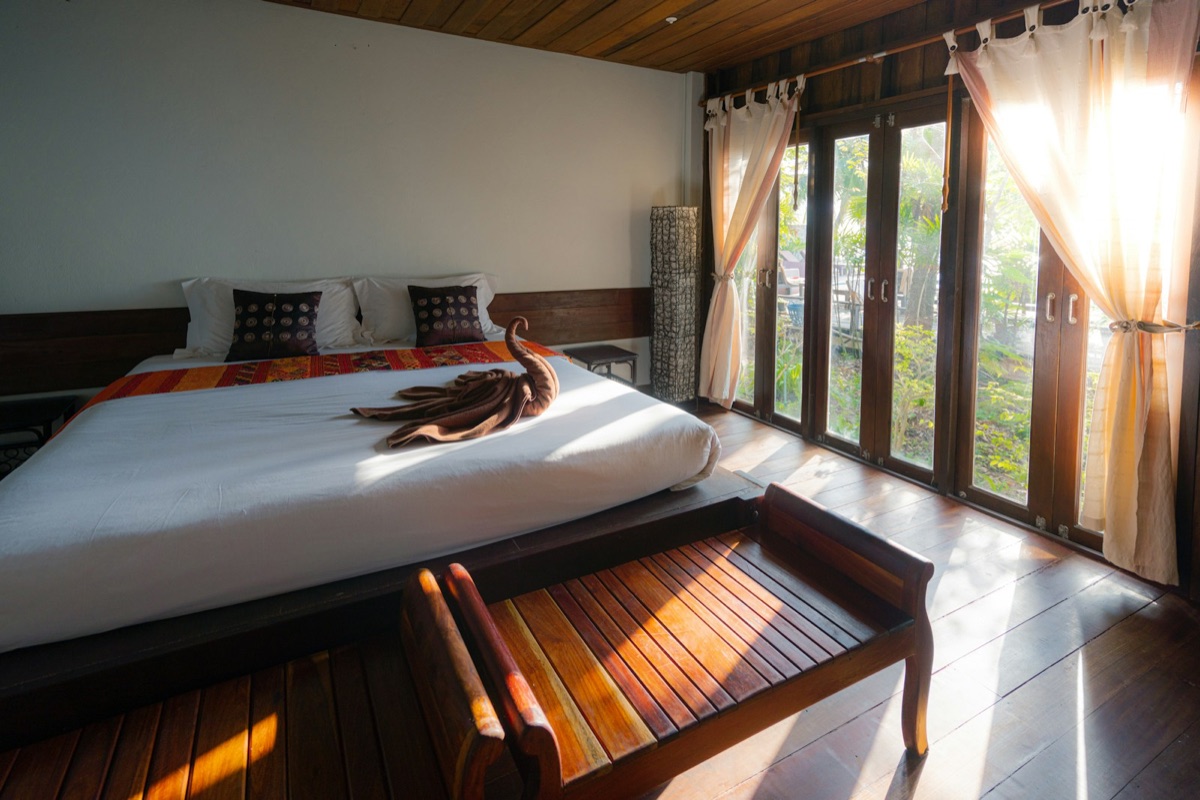 Indoor teak bedroom furniture in a tropical interior