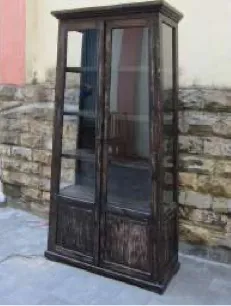 Dark glazed cabinet, carved base