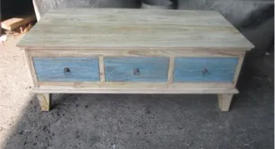 Whitewashed table, blue drawers