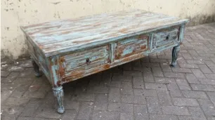 Blue-washed table with drawers