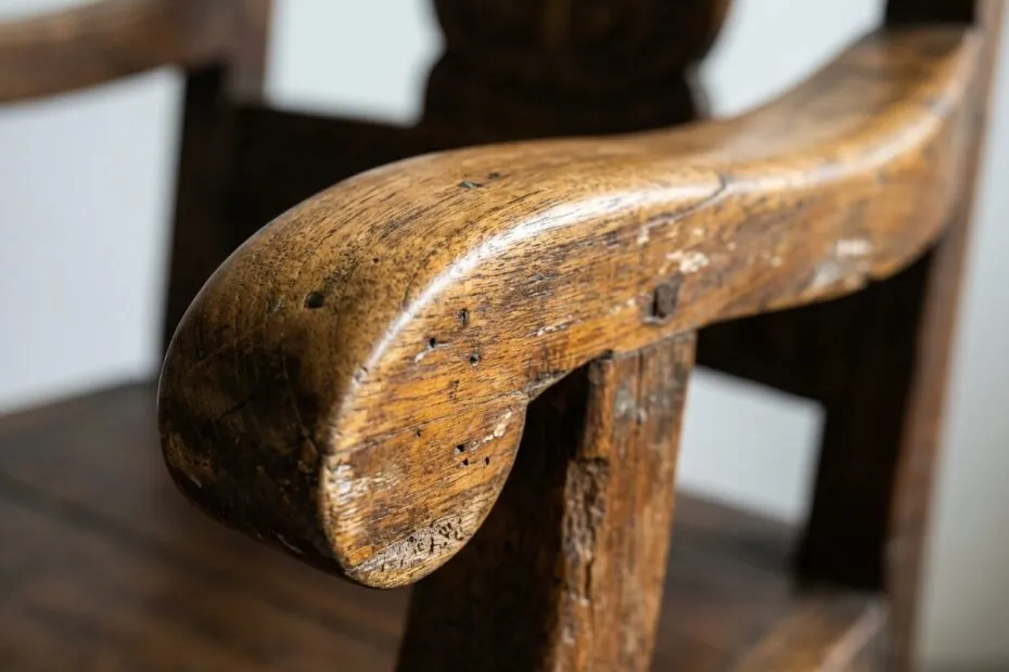 Wear on the arm of an antique Indonesian teak chair